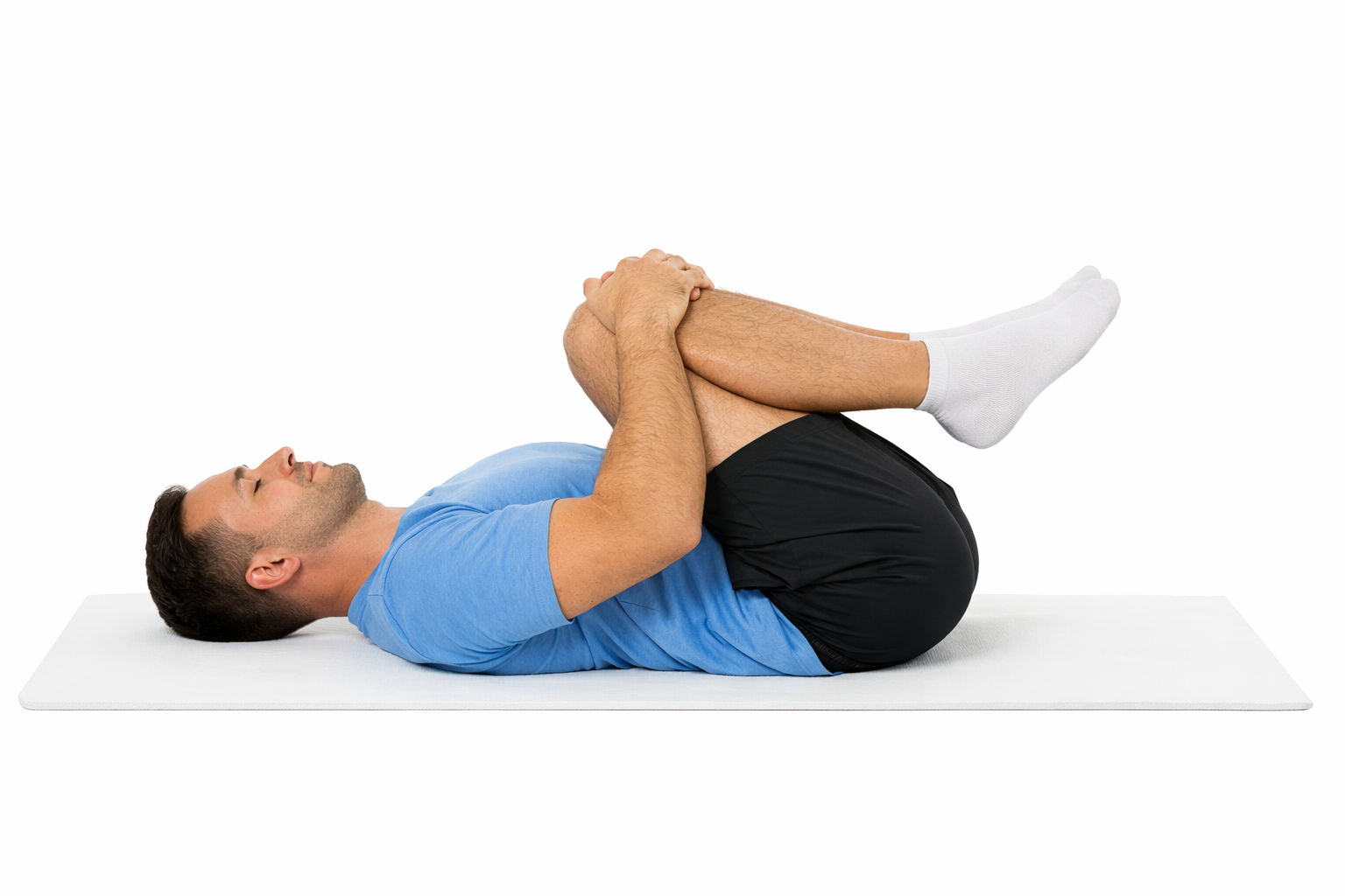 Estiramiento lumbar con rodillas al pecho